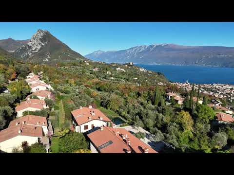 Trilocale con giardino vista lago in residence con piscina