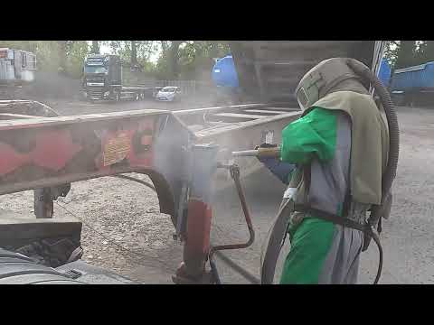 SandBlasting rust off a bulk trailer