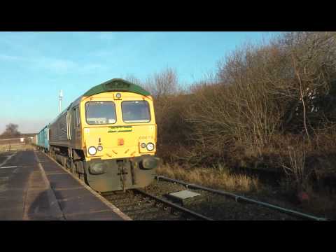 Class 66 Diesel 66619 passing through Denton Station