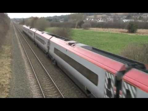 57304 and 390010 on 1D83, 08:50, London Euston - Holyhead