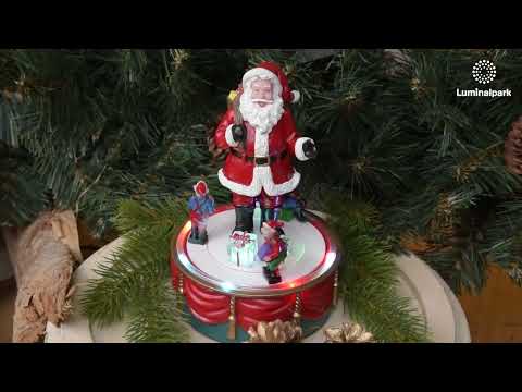 Father Christmas with rotating elves, h 19 cm, Christmas music