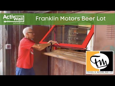 We custom-built a bright red Gas Strut Window for this new business in Chapel Hill, North Carolina. The window coordinates with an eclectic mix of vintage automotive and industrial decor that makes the Franklin Motors Beer Lot and Roquette at Franklin Motors a visually appealing and fun place to hang out.