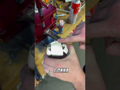 Installing a piston on a connecting rod.
