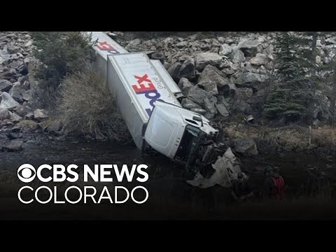 FedEx semi truck goes off Colorado's I-70, driver and passenger injured