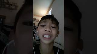 A kid singing  high  hopes
