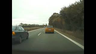 Driver almost hitting a car while overtaking.