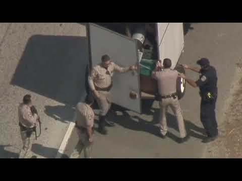 Police pursuit of stolen SUV pulling a trailer at high speeds