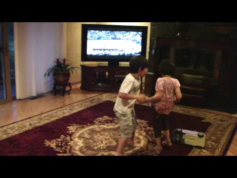 little girl beats older boy up