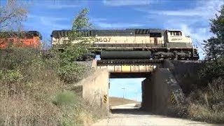 preview picture of video 'Executive MAC leads BNSF UCEX coal train over small bridge'