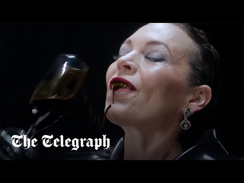 Olivia Colman poses as latex wearing oil executive in new campaign video