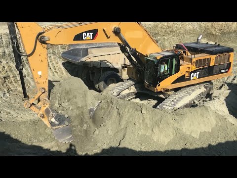 Caterpillar 6015B - Caterpillar 385C - 365C And Liebherr 964 Excavators Loading Trucks