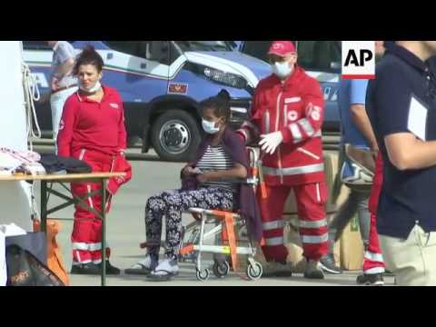 Rescued migrants disembark in Sicily
