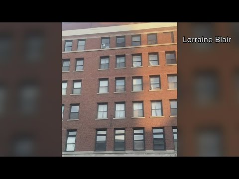 Dramatic video shows woman emerging from Davenport apartment building set for demolition the next mo