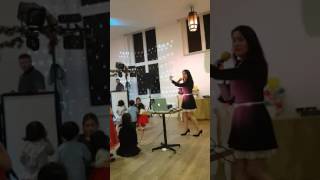 Singing Santa Baby at the Filipino Christmas Party