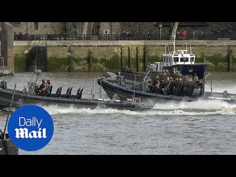 Royal Marines carry out military exercises on the Thames