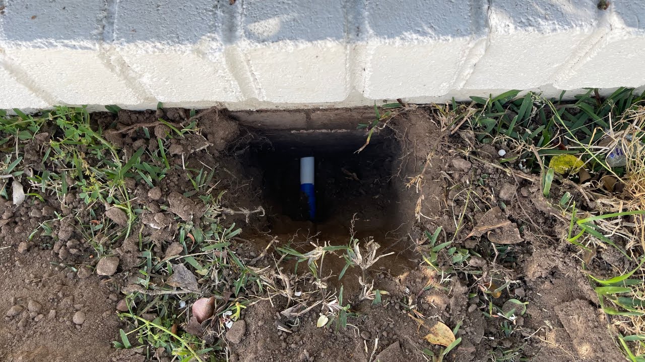 SECURE A COM technician trenching through heavy overgrowth, tree roots and underground services for NBN FTTP conduit installation in Sydney
