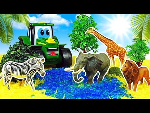 Le tracteur Johnny fait la connaissance d’animaux sauvages. Jeux avec jouets pour enfants.