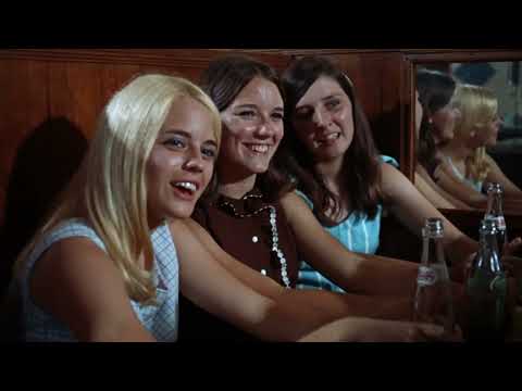 Easy Rider trailer still: Fonda and Hopper riding choppers on an open highway with desert mountains