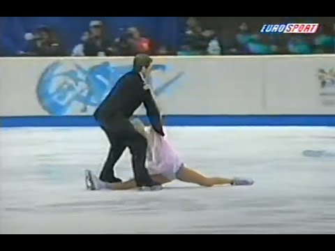 Beautiful flexible girl sits in beautiful SPLITS on cold ice