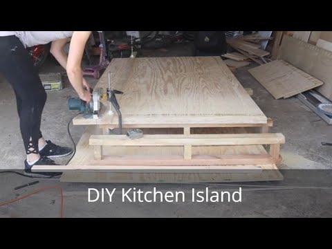 Part of a video titled DIY Kitchen Island | Cheap Kitchen Island From Desk - YouTube
