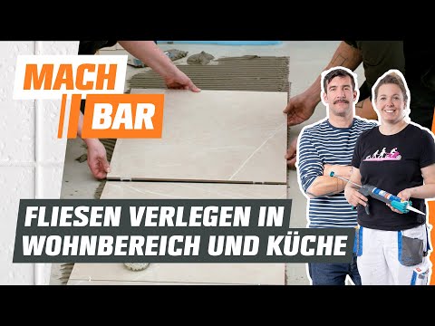 Laying tiles in the living area & kitchen | OBI