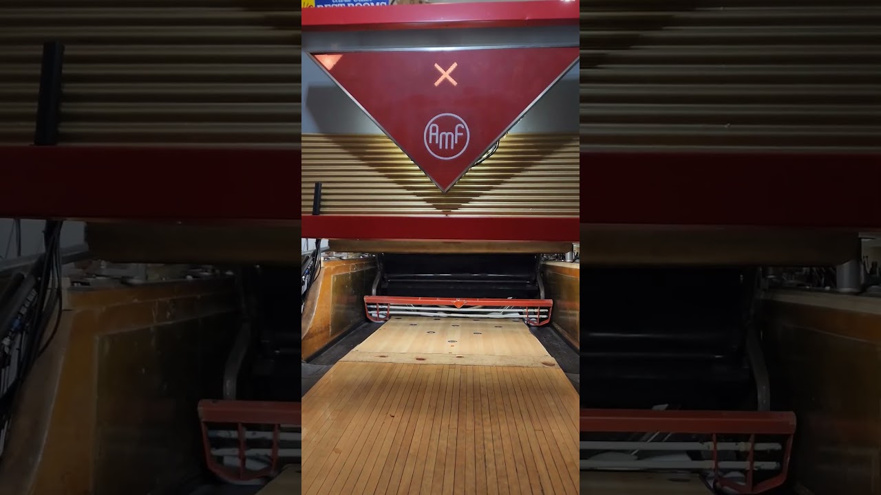 Strike cycle on a Brunswick pinsetter AMF Streamlane masking unit and 83-30 sweep