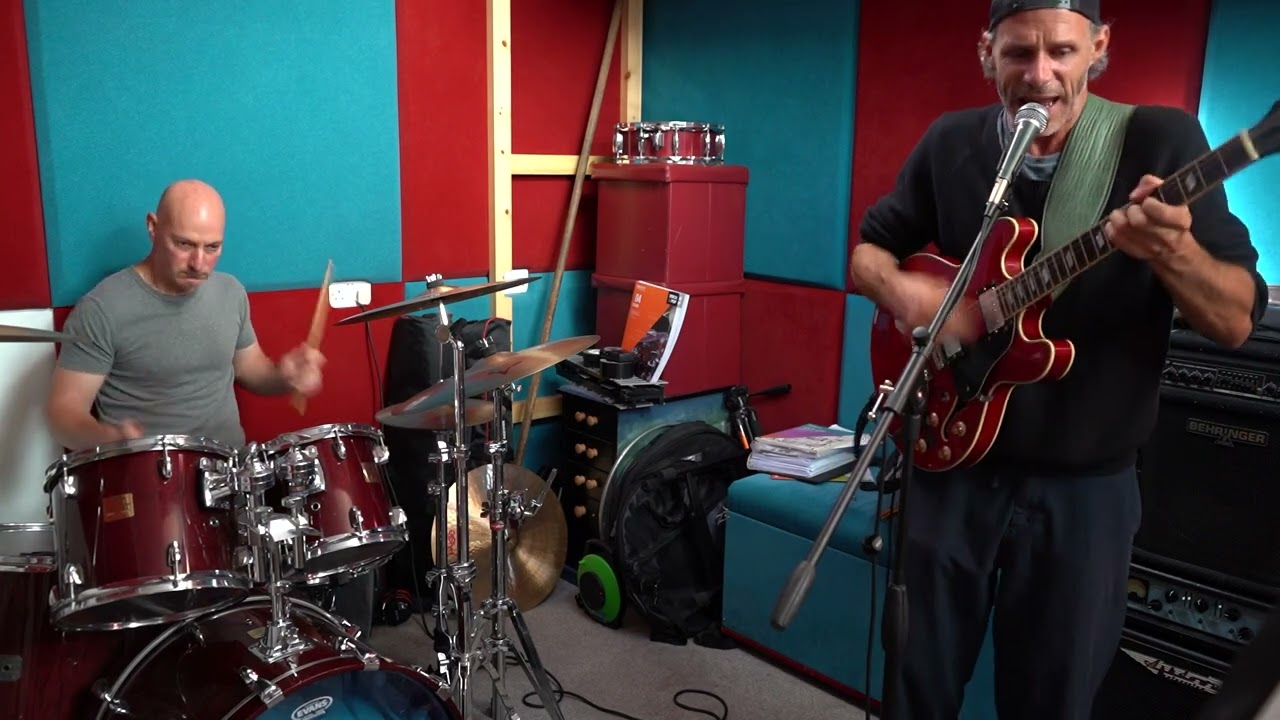 King With No Throne rehearsing at Harrow Music Studio – drummer and guitarist in the acoustic-treated rehearsal room