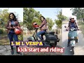 L M L Vespa Kick Start And Riding By Woman