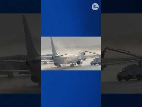 Airplane de-iced at Rochester airport in winter chill, see video