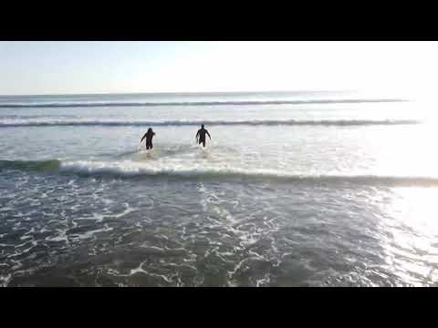 Drone footage of Hobuck Beach and surfers