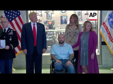 Trump awards Purple Heart at military hospital