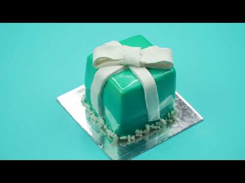 Bright and Colorful Cake Gift on a Blue Background