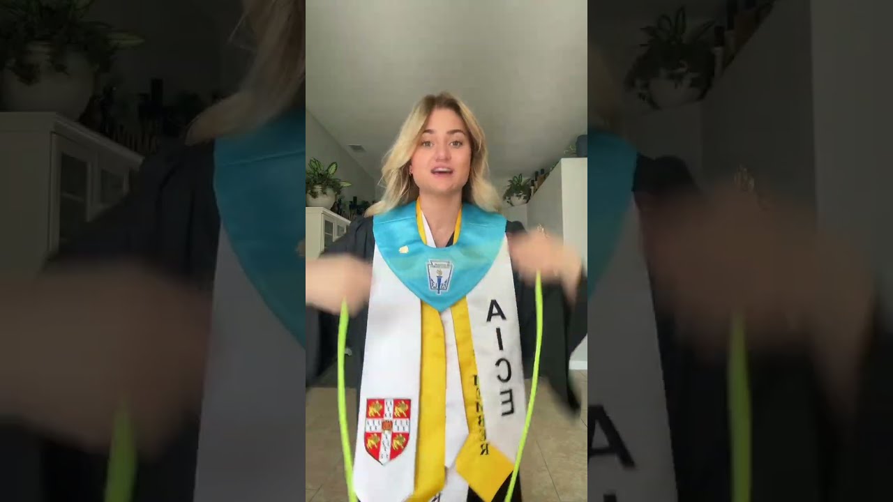 Girl is showing each core, stole, and medals that she received as graduation honors!