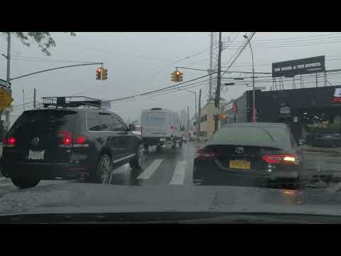 Rainy afternoon on Interstate I 495 West heading to Exit 16 in Queens, NY - August 10 2023