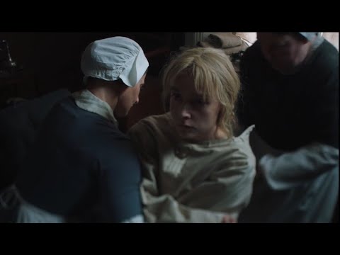 Blonde girl in straitjacket