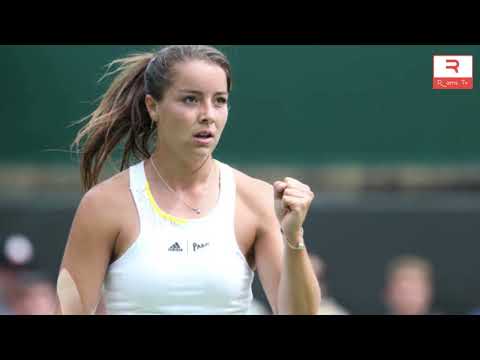 Britain's Jodie Burrage comes to the aid of unwell ball boy with sweets during first round Wimbledon
