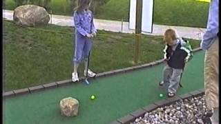 Spencer, age 3, making a hole-in-one playing miniature golf