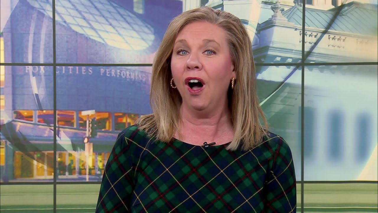 Holiday Lights: De Pere home features Candy Cane light tunnel with burst of colors