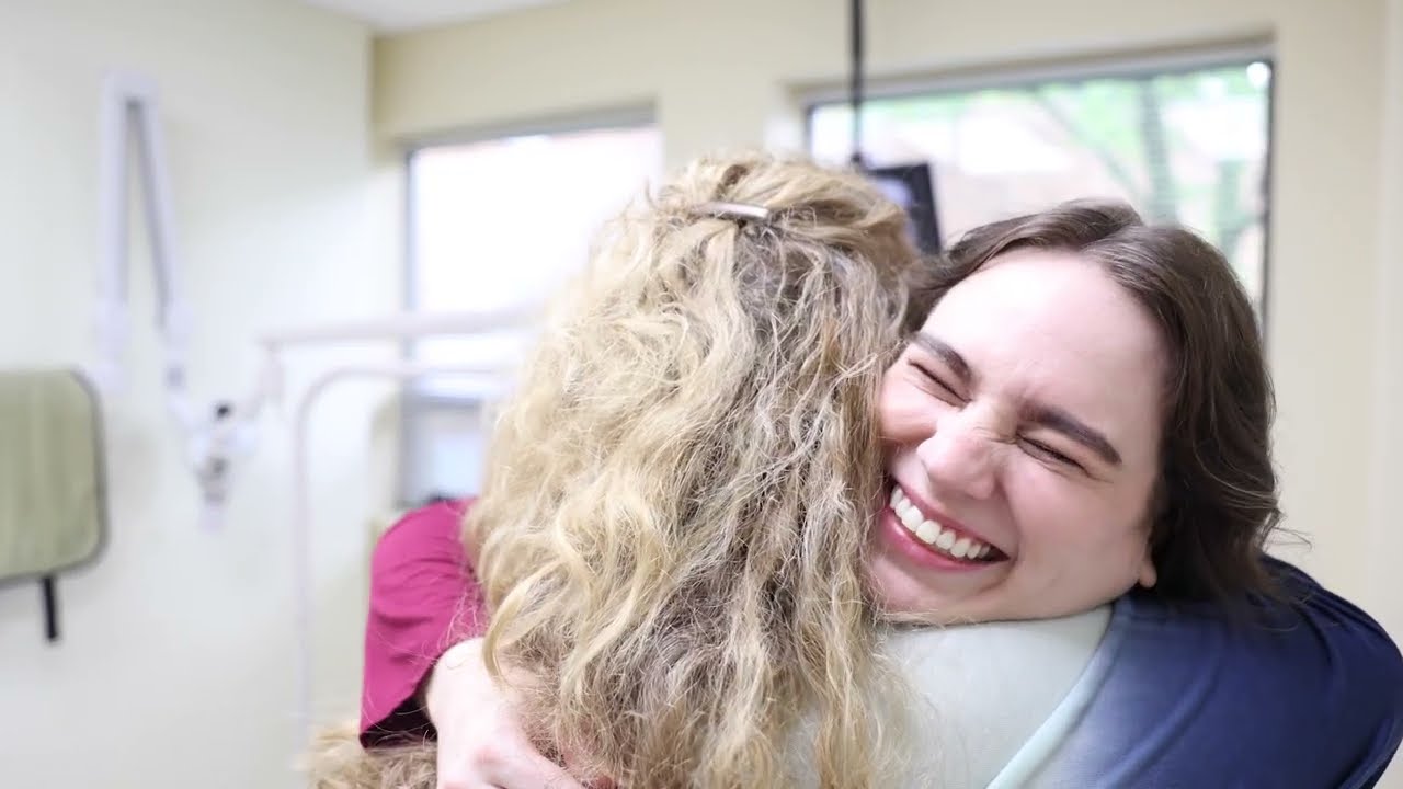 Two women hugging in Lorain endodontic office