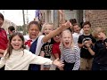 Students sing "When the Saints Go Marching In" in French 🥐 to celebrate the Saints in France