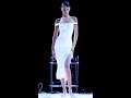 Bella Hadid Gets A Spray On Dress During Paris Show