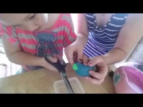 My little sister  cutting open mesh ball