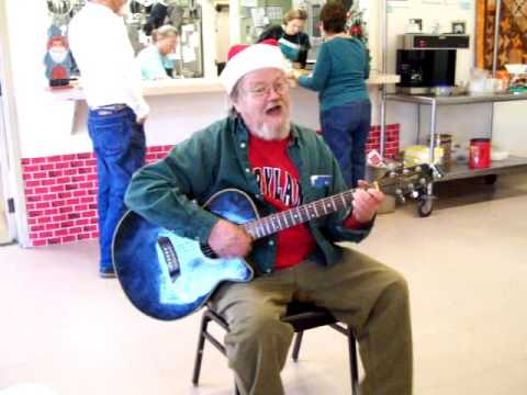 Alex singing I Saw Mommy Kissing Santa Claus at the Senior Center Christmas Lunch