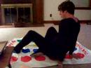 Zak in a onezee playing twister and doing magic