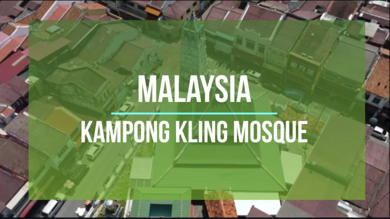A tourist delves into the captivating beauty of Kampung Kling Mosque.