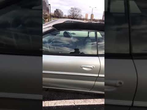 Spark plug breaks car window