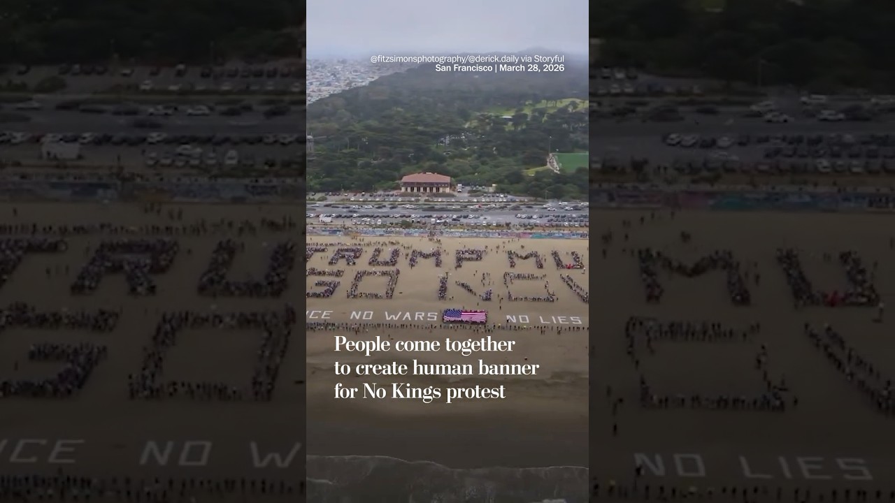 People come together to create human banner for No Kings protest