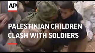 Palestinian children clash with soldiers at checkp