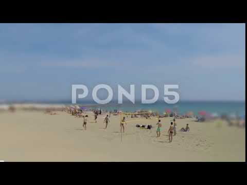 Handsome Men Play Beach Volleyball - Stock Footage