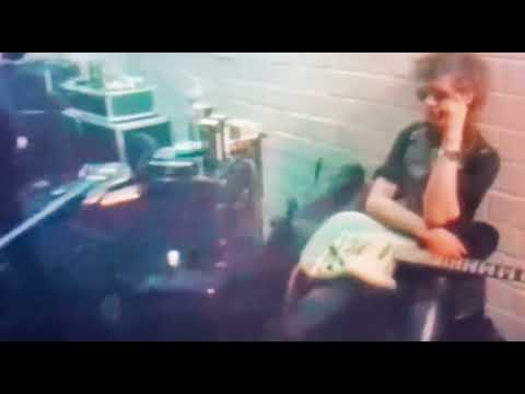 Blixa Bargeld stunning Nick Cave with an eyebrow raise